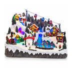 Villaggio di Natale luminoso con piste da sci e pattinaggio in movimento, luci LED e musica – 56x37x42 cm