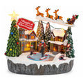 Villaggio Natalizio Luminoso Snowtime con Pista di Pattinaggio Animata, Luci LED e Musica, Slitta di Babbo Natale, Poliresina 21,5x15,8x22,5 cm